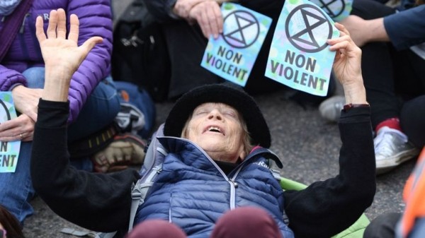 Extinction Rebellion protester climbs on plane at London City Airport
 
Extinction Rebellion protester climbs on plane at London City Airport