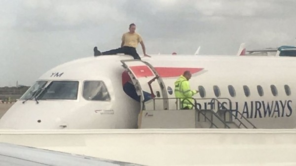 Extinction Rebellion protester climbs on plane at London City Airport
 
Extinction Rebellion protester climbs on plane at London City Airport