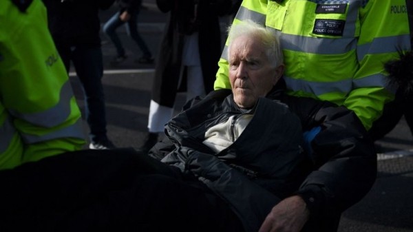 Extinction Rebellion protester climbs on plane at London City Airport
 
Extinction Rebellion protester climbs on plane at London City Airport