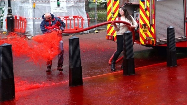
Extinction Rebellion protesters use fire engine to spray Treasury with fake blood
