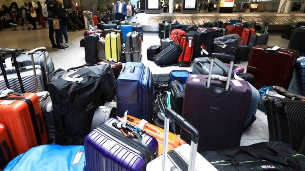 Chaos at Heathrow as baggage delays described as 'disgraceful' and a 'shambles' by British Airways passengers Chaos at Heathrow as baggage delays described as 'disgraceful' and a 'shambles' by British Airways passengers