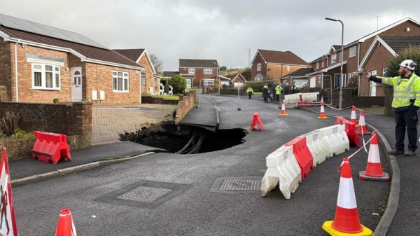 Large sinkhole opens up in South Wales as residents told to stay away Large sinkhole opens up in South Wales as residents told to stay away