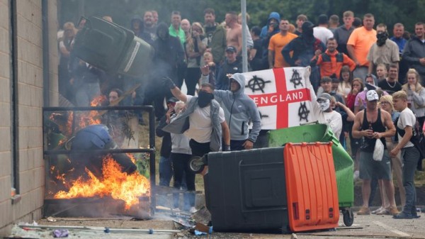 Police 'immensely brave' but forces were unprepared for summer riots, says report