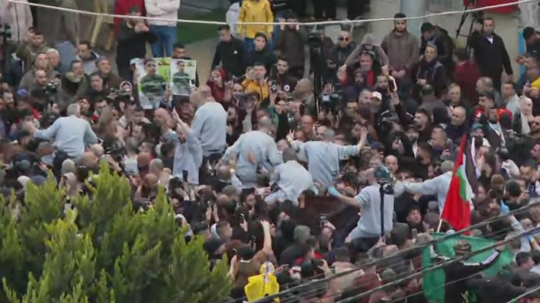 Four female soldiers reunite with families in Israel - as freed Palestinian prisoners carried by huge crowds in West Bank