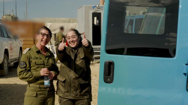 Four female soldiers reunite with families in Israel - as freed Palestinian prisoners carried by huge crowds in West Bank