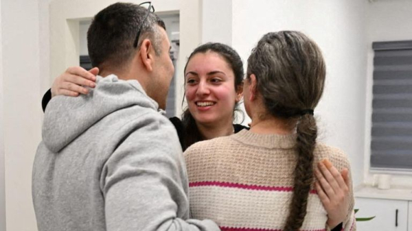 Four female soldiers reunite with families in Israel - as freed Palestinian prisoners carried by huge crowds in West Bank