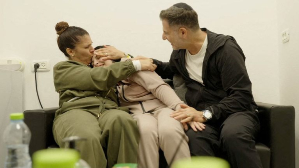 Four female soldiers reunite with families in Israel - as freed Palestinian prisoners carried by huge crowds in West Bank