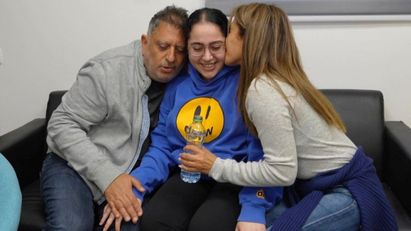 Four female soldiers reunite with families in Israel - as freed Palestinian prisoners carried by huge crowds in West Bank