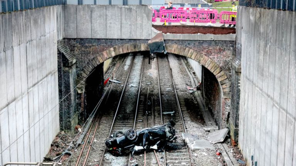 Major travel disruption in Manchester after car crashes onto railway lines - driver arrested Major travel disruption in Manchester after car crashes onto railway lines - driver arrested