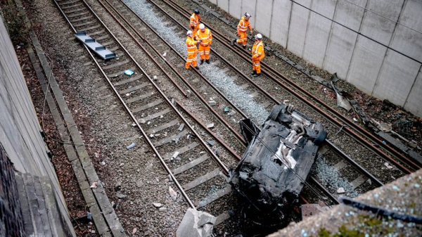 Major travel disruption in Manchester after car crashes onto railway lines - driver arrested Major travel disruption in Manchester after car crashes onto railway lines - driver arrested