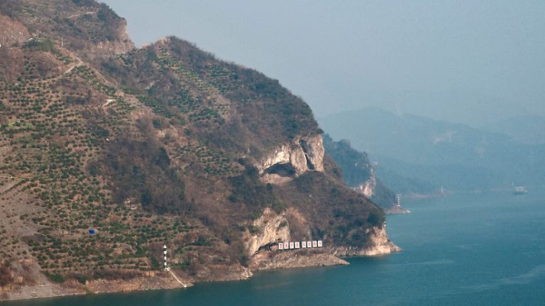 'Puppy mountain' along Chinese river draws in tourists 'Puppy mountain' along Chinese river draws in tourists