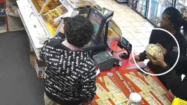 CCTV shows shoplifters using pythons to distract cashier before stealing from petrol station CCTV shows shoplifters using pythons to distract cashier before stealing from petrol station
