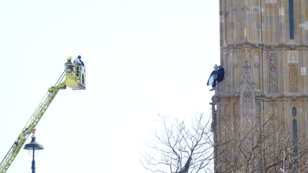 Man holding Palestinian flag who climbed up Elizabeth Tower comes down Man holding Palestinian flag who climbed up Elizabeth Tower comes down