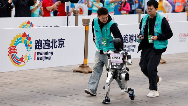 China hosts world's first half-marathon race between humans and robots