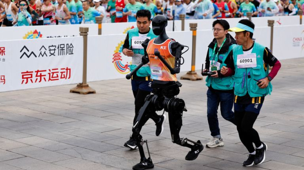China hosts world's first half-marathon race between humans and robots