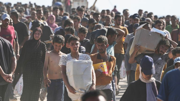 Palestinians flock to Gaza aid centres despite concerns - as lawyers call for sanctions on Israel