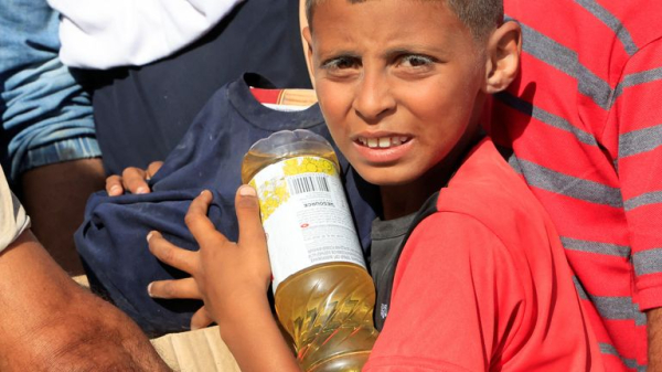 Palestinians flock to Gaza aid centres despite concerns - as lawyers call for sanctions on Israel