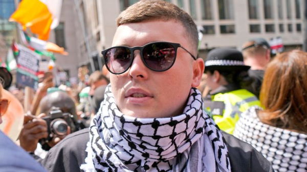 Kneecap rapper appears in court on terror charge - as protesters gather outside