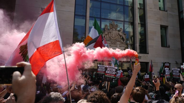 Kneecap rapper appears in court on terror charge - as protesters gather outside