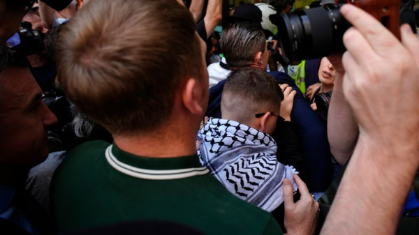 Kneecap rapper appears in court on terror charge - as protesters gather outside