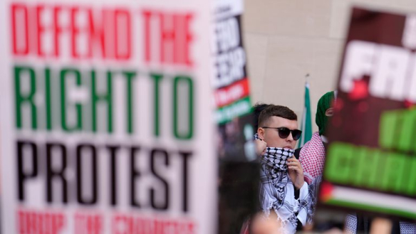 Kneecap rapper appears in court on terror charge - as protesters gather outside