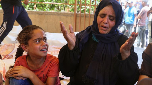 'At least 59 killed' in Gaza after Israeli military opens fire near aid centre and carries out strikes