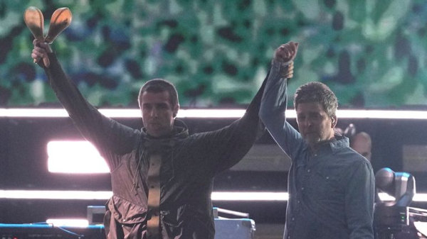 Gallagher brothers share a high-five and hug as Oasis reunite on stage after 16 years Gallagher brothers share a high-five and hug as Oasis reunite on stage after 16 years