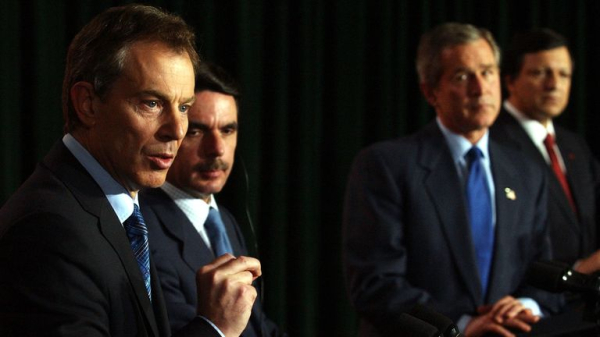 President Bush determined to 'rid world of evil-doer Saddam Hussein', new records reveal