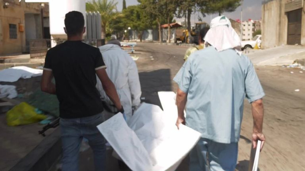 Rows of decomposing bodies that haven't been buried because of fierce fighting in Syrian city