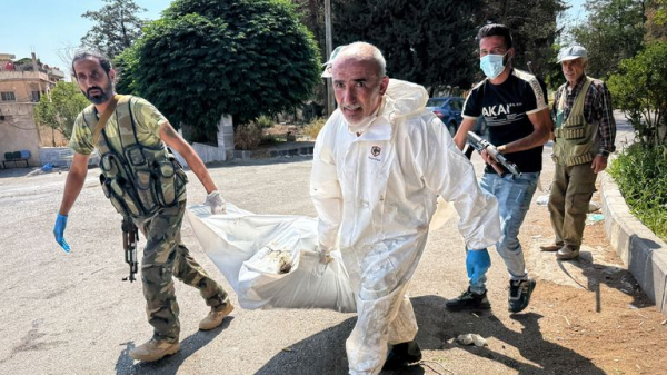 Rows of decomposing bodies that haven't been buried because of fierce fighting in Syrian city