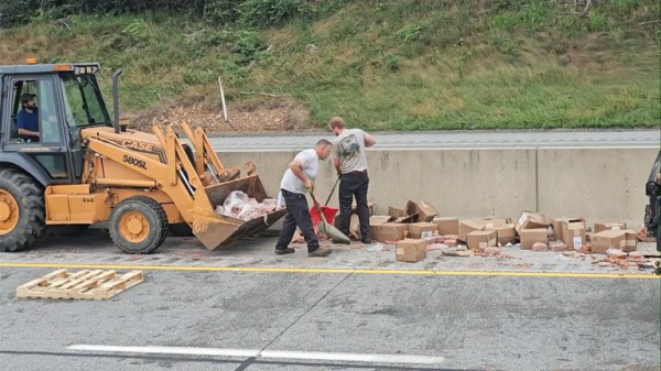 Thousands of hot dogs spill across busy highway 
