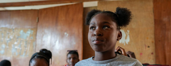&lsquo;Do not give up on children&rsquo;: Displaced by violence, a Haitian girl finds hope at school
